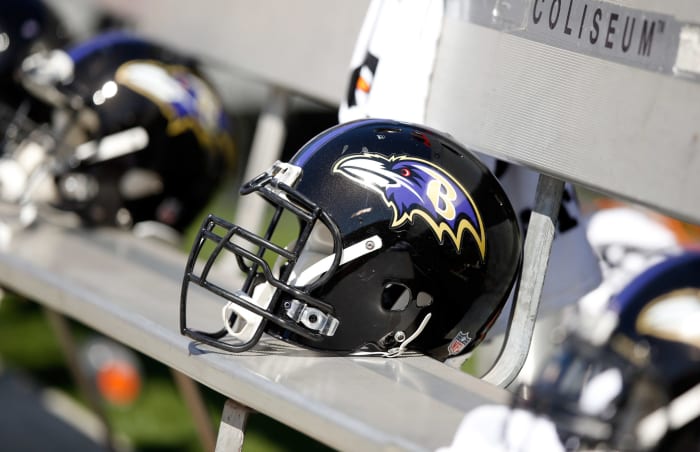 A Baltimore Ravens helmet sitting on a bench.