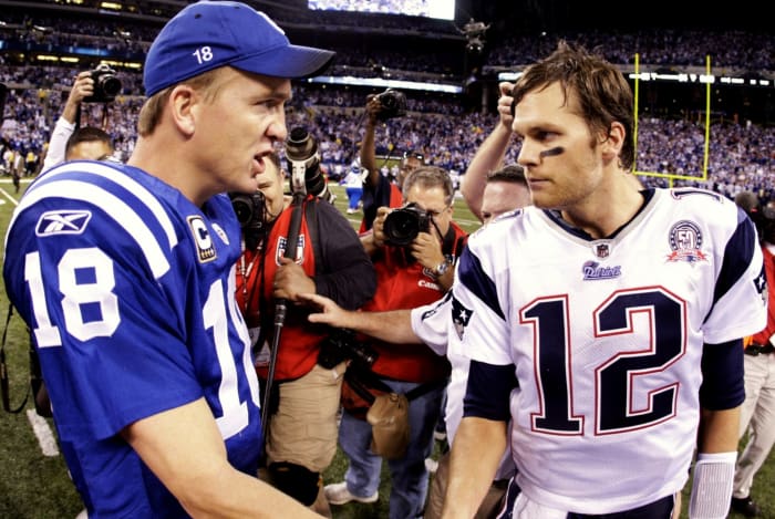 Colts QB Peyton Manning shaking hands with Tom Brady.