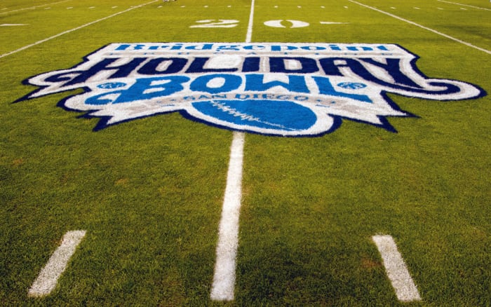 A close-up of the Holiday Bowl logo on the field.