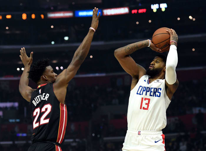 Los Angeles Clippers star Paul George pulls up against Jimmy Butler.