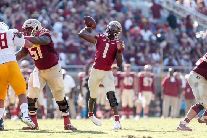 James Blackman throws a pass for Florida State.