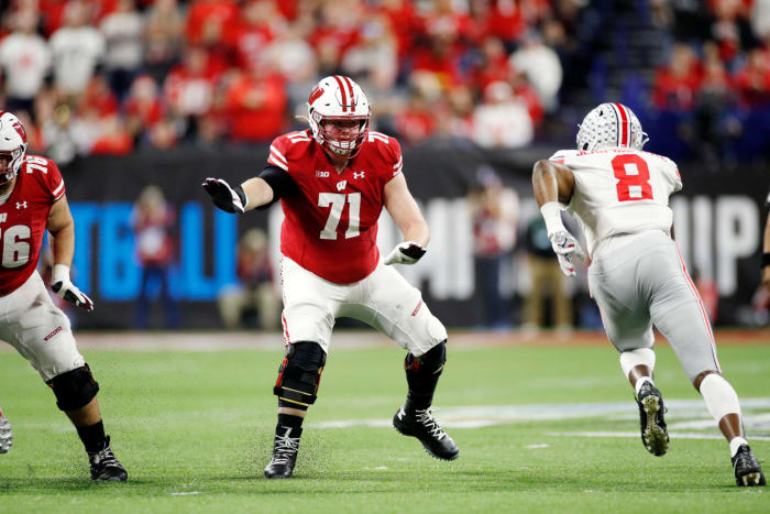 Wisconsin offensive tackle Cole Van Lanen blocks in the Big Ten Championship.