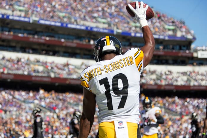 JuJu Smith-Schuster celebrating after catching a touchdown pass.