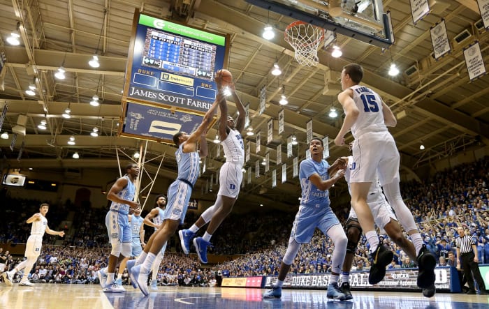 Duke and North Carolina players going up for a rebound.