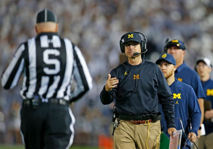 Jim Harbaugh coaching a game for Michigan.