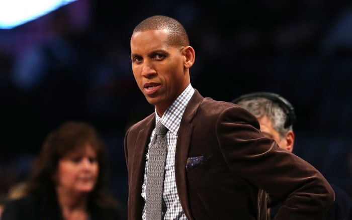 Reggie Miller looks on during the Slam Dunk Contest.