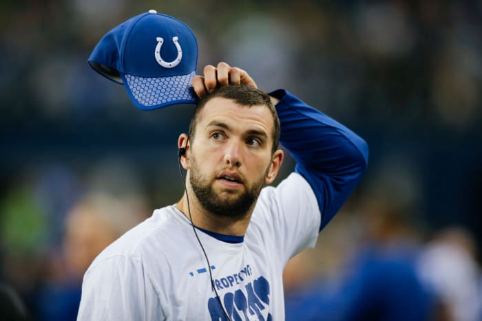 Colts QB Andrew Luck scratches his head before a game.