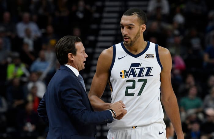 Rudy Gobert talking to Utah Jazz coach Quin Snyder.