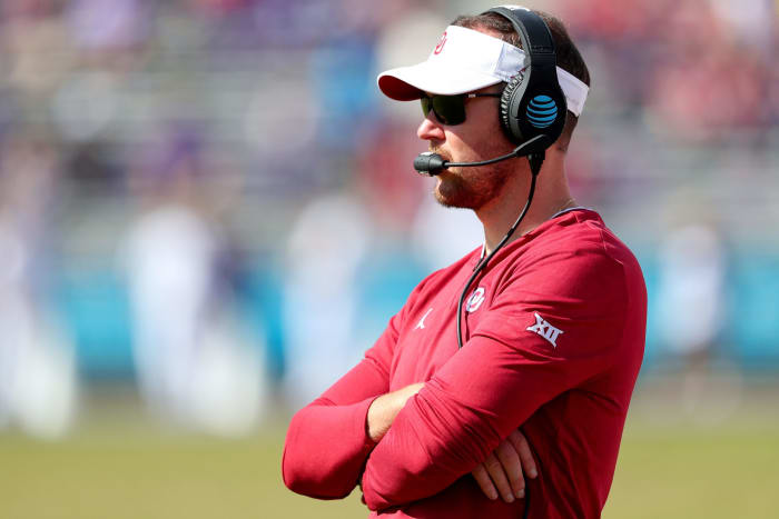 A closeup of Oklahoma Sooners coach Lincoln Riley during a game.