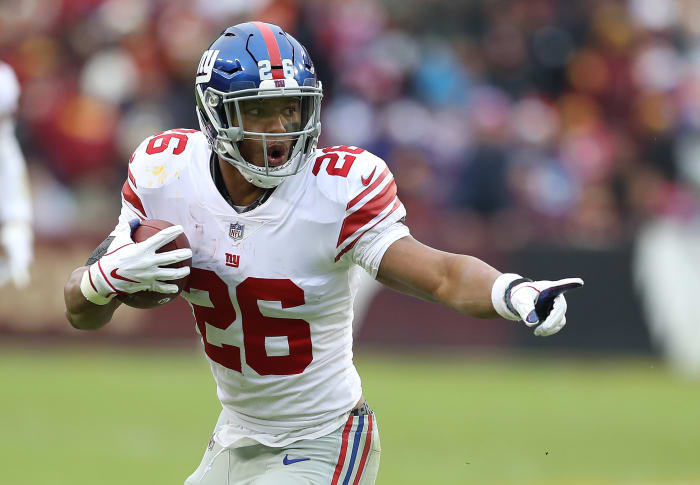 Saquon Barkley running the ball for the New York Giants.