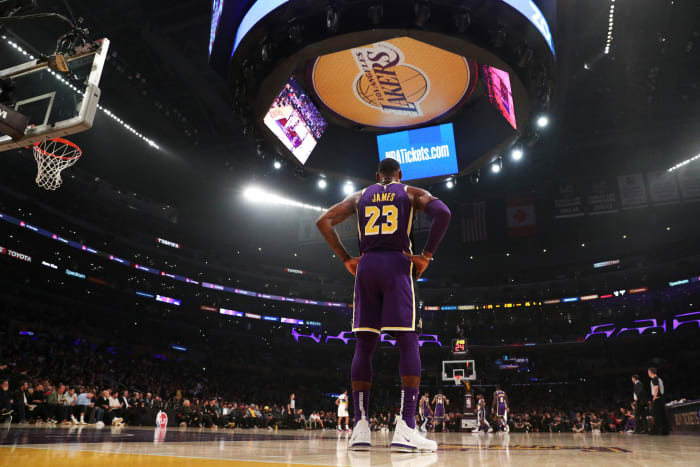 LeBron James stands at the baseline in Staples Center during a Lakers game.