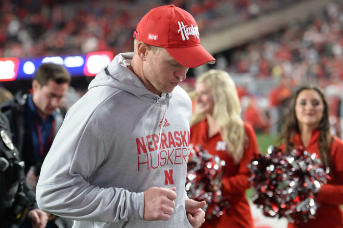 Nebraska football head coach Scott Frost runs off the field after a loss to Ohio State.