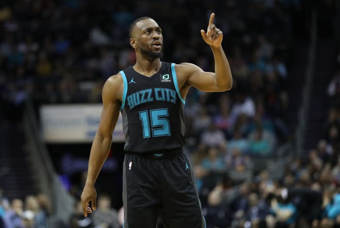 A photo of Kemba Walker in the Hornets alternate uniform.