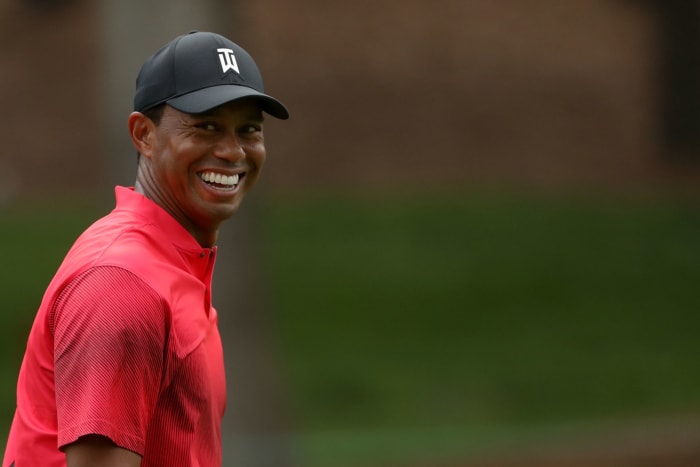 Tiger Woods smiling.
