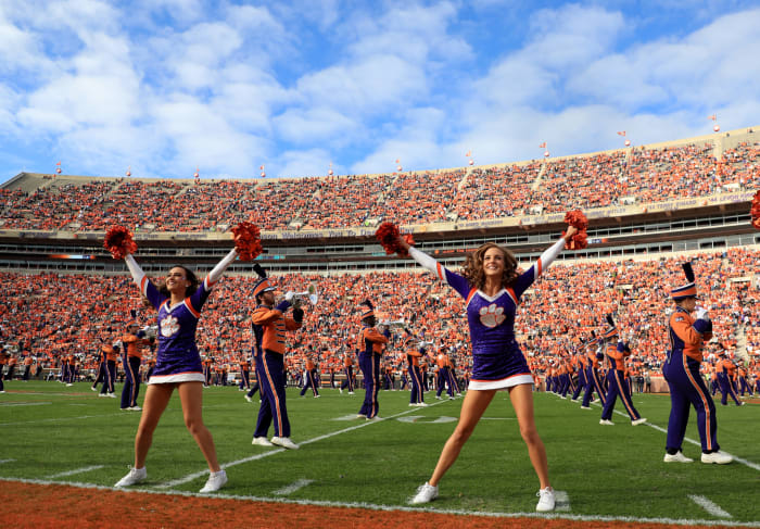 Clemson football cheerleaders on the field.