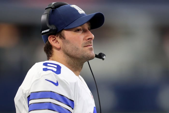 Tony Romo on the sideline with a headset on.