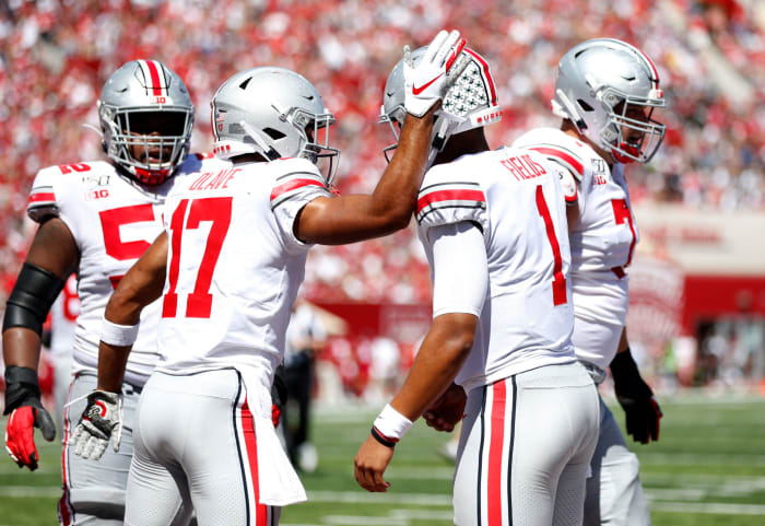 Ohio State players including Justin Fields and Chris Olave celebrate a win at Indiana.