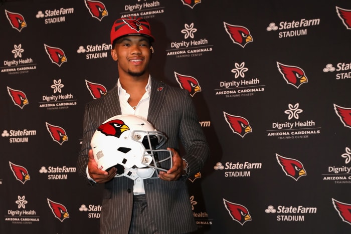 Kyler Murray with an Arizona Cardinals helmet.