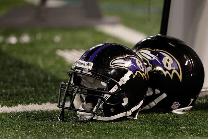 Closeup of two Baltimore Ravens football helmets.