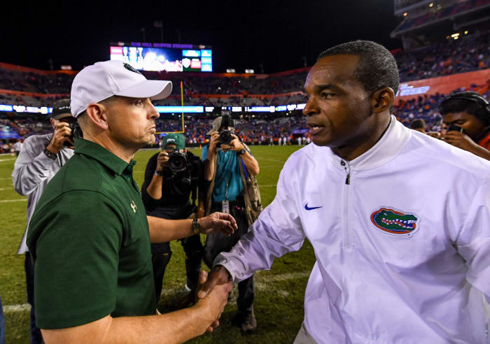 UAB's Bill Clark greets Randy Shannon.