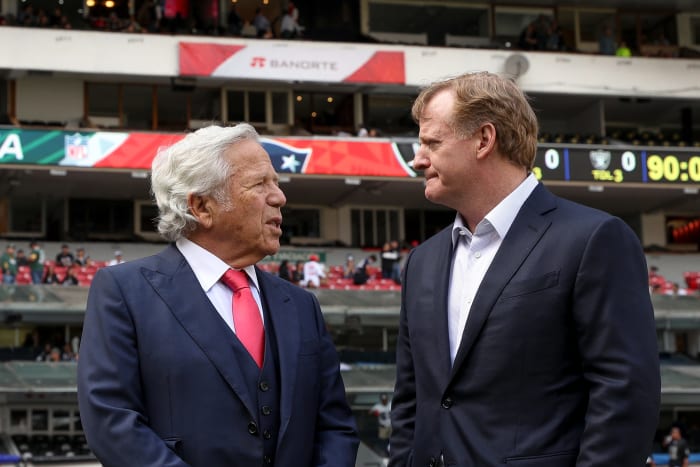 Roger Goodell talking with Robert Kraft.