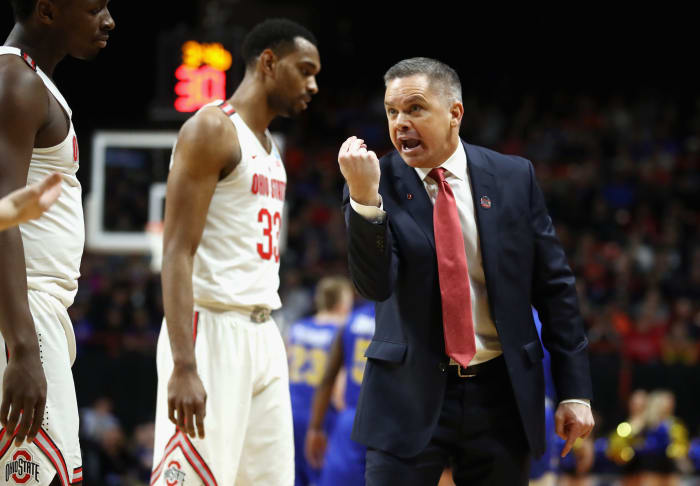 Ohio State basketball coach Chris Holtman reacting during a game.
