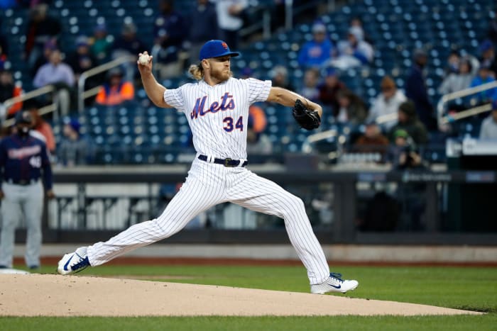 Mets' Noah Syndergaard throwing a pitch.