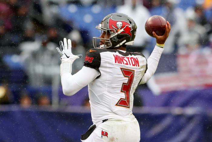 A closeup of Jameis Winston throwing a pass.