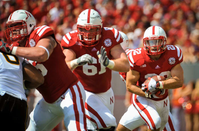 Spencer Long leads the way for Rex Burkhead on a Nebraska running play.