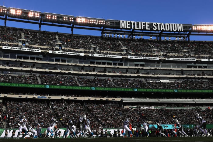 Quarterback Cam Newton of the Carolina Panthers looks to pass against the New York Jets.