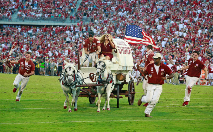 Oklahoma's Sooner Schooner runs onto the field.