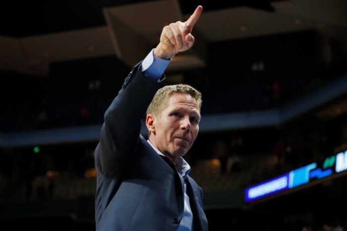 Mark Few pointing into the crowd.