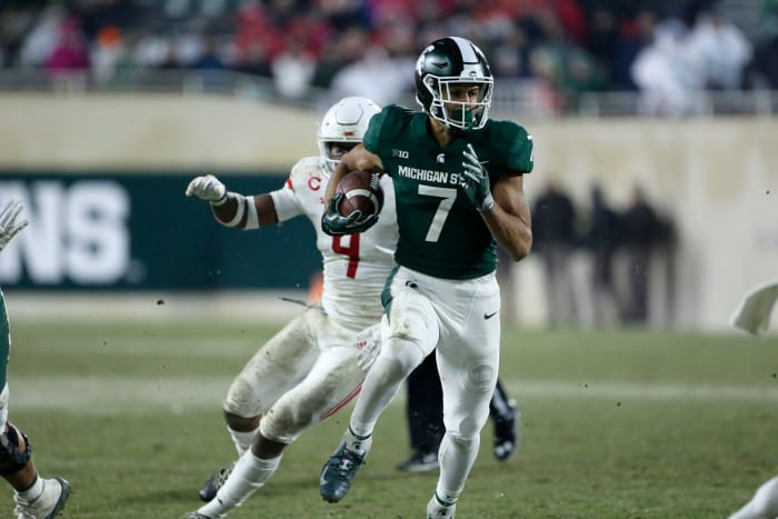 Michigan State wide receiver Cody White runs with the ball.