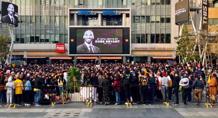 Lakers fans mourn outside of Staples Center.