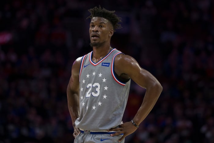 Jimmy Butler standing with his hands on his hips during a game.