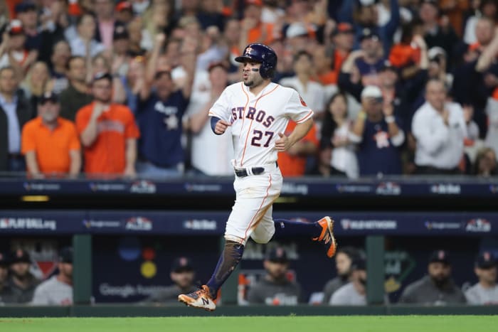 Jose Altuve scoring a run.