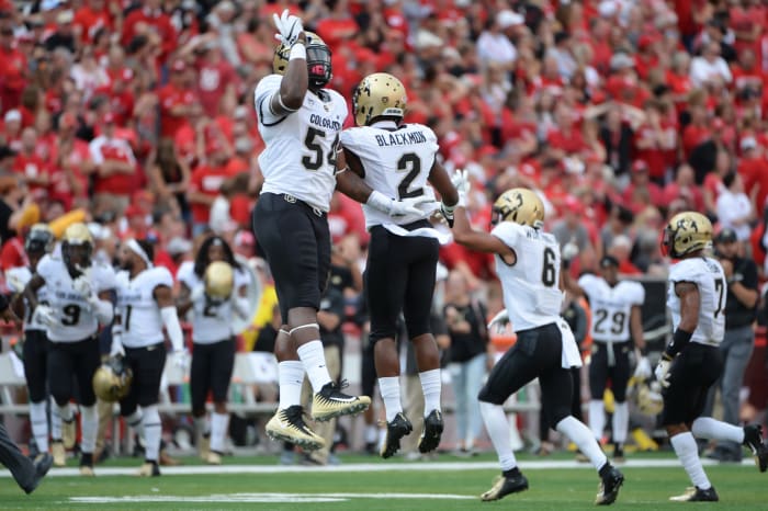 Colorado players including Ronnie Blackmon celebrate a play vs. Nebraska.