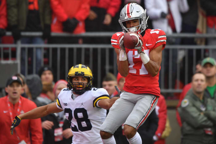 Ohio State star Chris Olave scores a touchdown against Michigan.