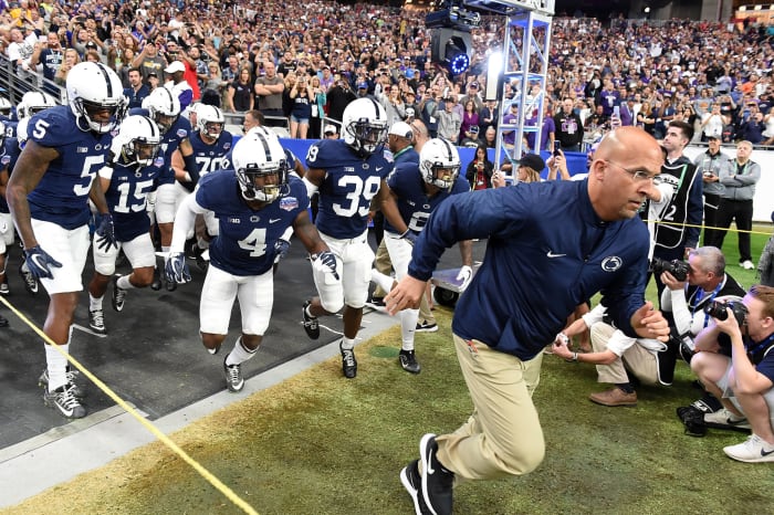 James Franklin running onto the field.