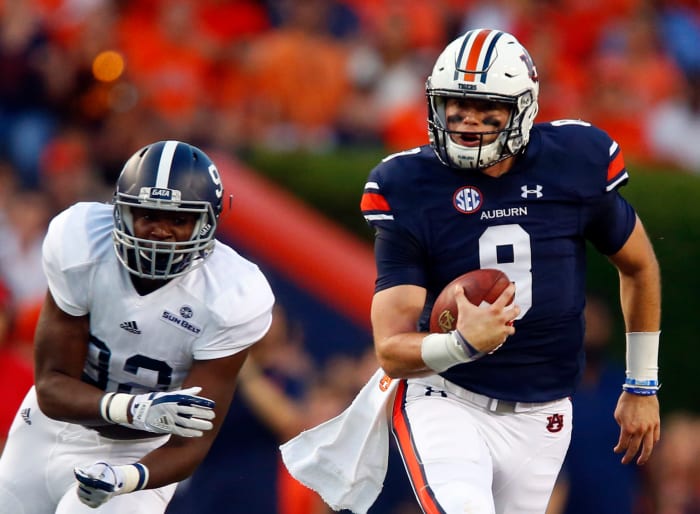 Jarrett Stidham scrambles away from a Georgia Southern defender.