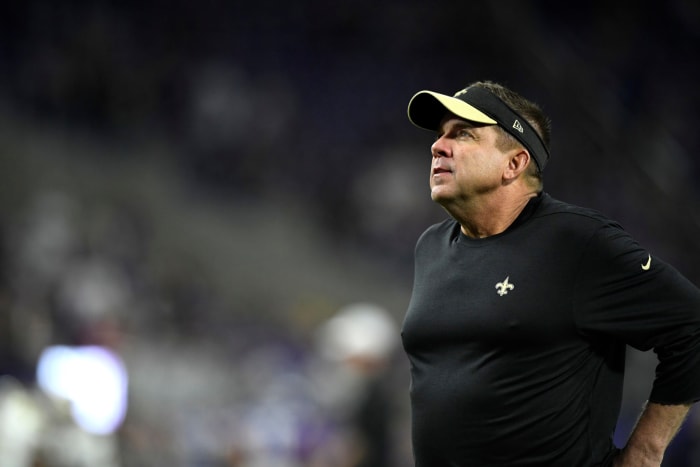 A closeup of New Orleans Saints coach Sean Payton wearing a black visor.