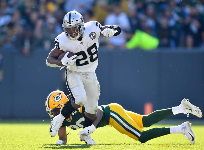 Josh Jacobs runs the football for the Oakland Raiders.