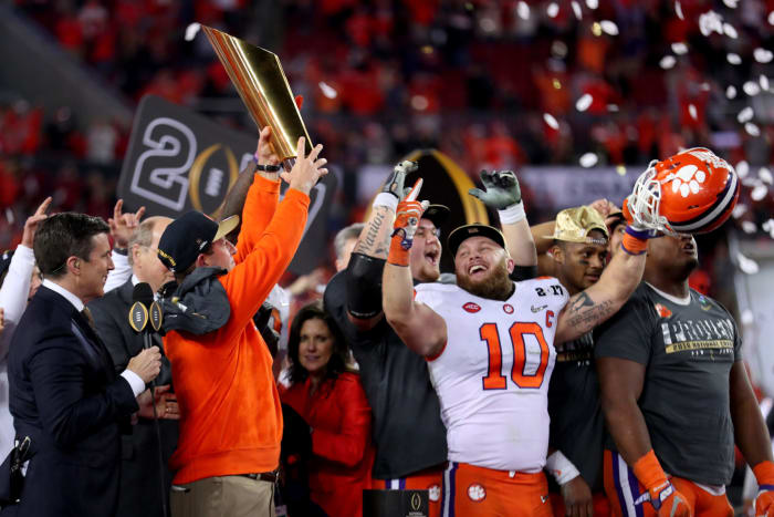 Head coach Dabo Swinney and players celebrate winning the national title.
