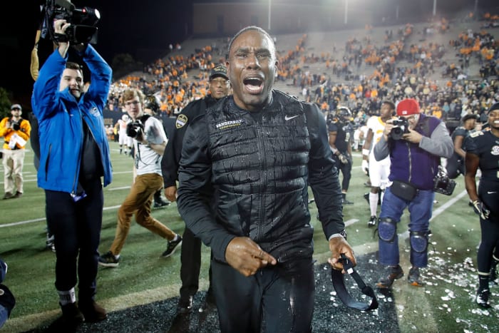 Vanderbilt head coach Derek Mason soaking wet after a Gatorade bath.