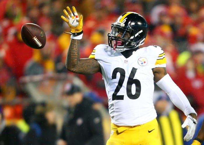 LeVeon Bell tossing the ball.