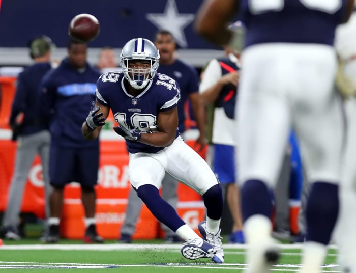 Amari Cooper catching a pass in the Dallas Cowboys away uniform.