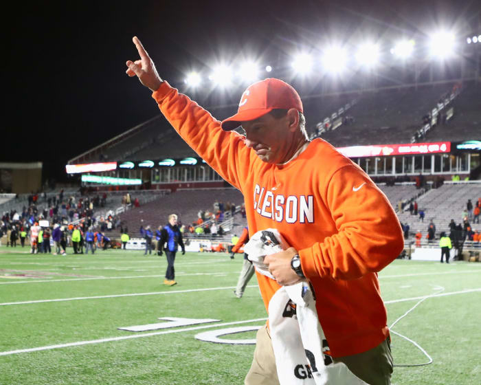 Dabo Swinney running off the field after a Clemson college football victory.