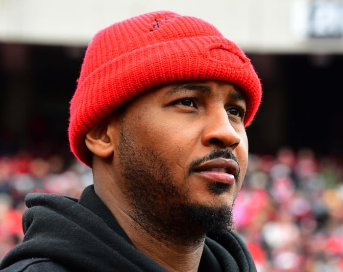 Carmelo Anthony wearing a red beanie.