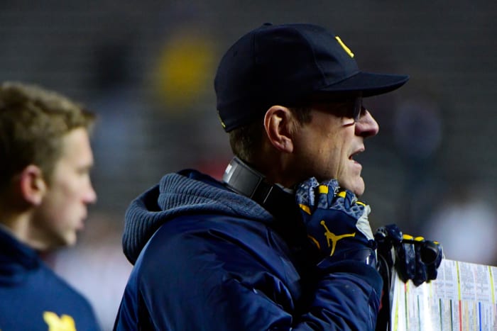 A closeup of Jim Harbaugh during a Michigan football game.
