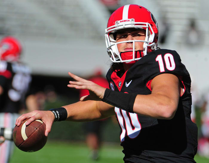 A closeup of Jacob Eason throwing the football.